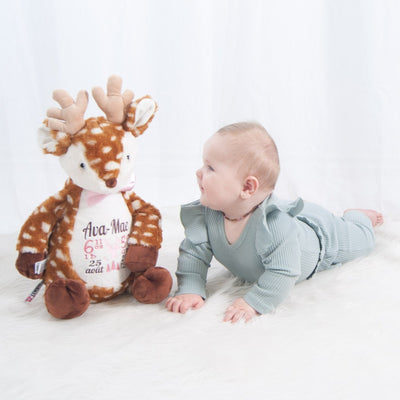 Baby with deer stuffie