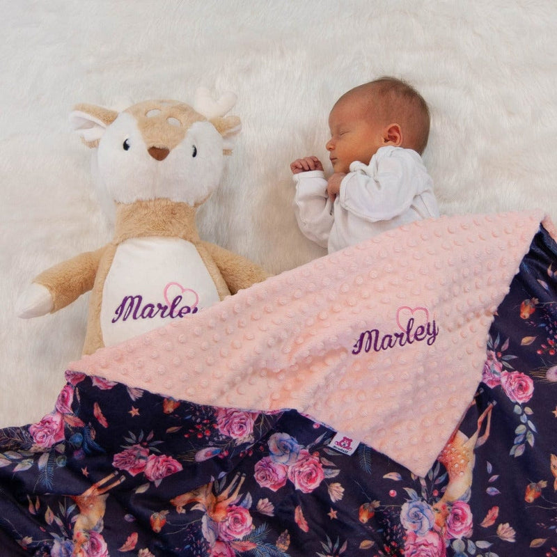 Baby girl with personalized stuffed animal fawn